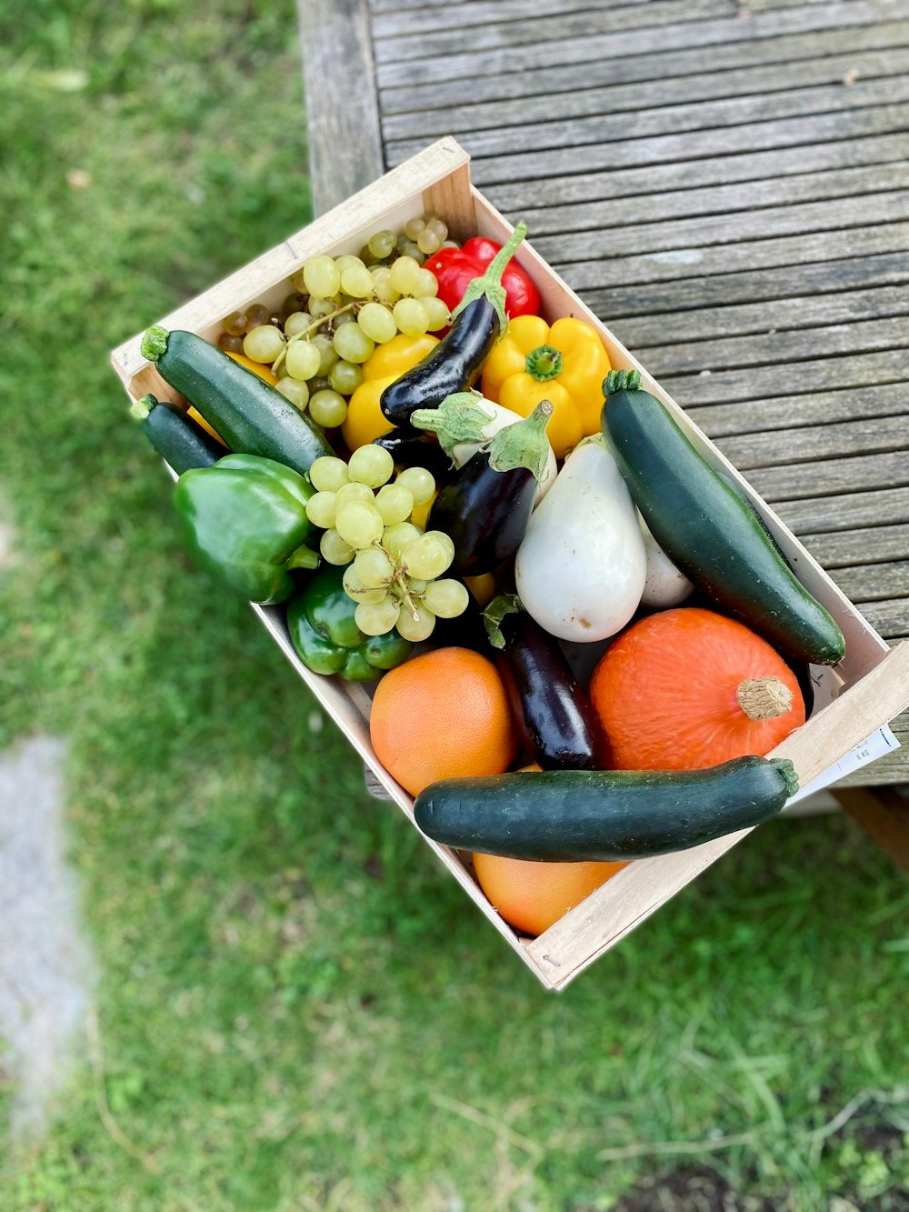 A crate of fresh fruits and vegetables